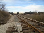  looking northeast at pile of ties at east end"of wye & at UP 9048 heading south